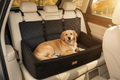 Extra large black dog car seat in back seat of SUV at golden hour